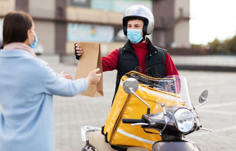 24936838326214courier-motorbike-delivering-package-wearing-protective-mask-standing-outside-fast-delivery-service-courier-motorbike-193706334.jpg